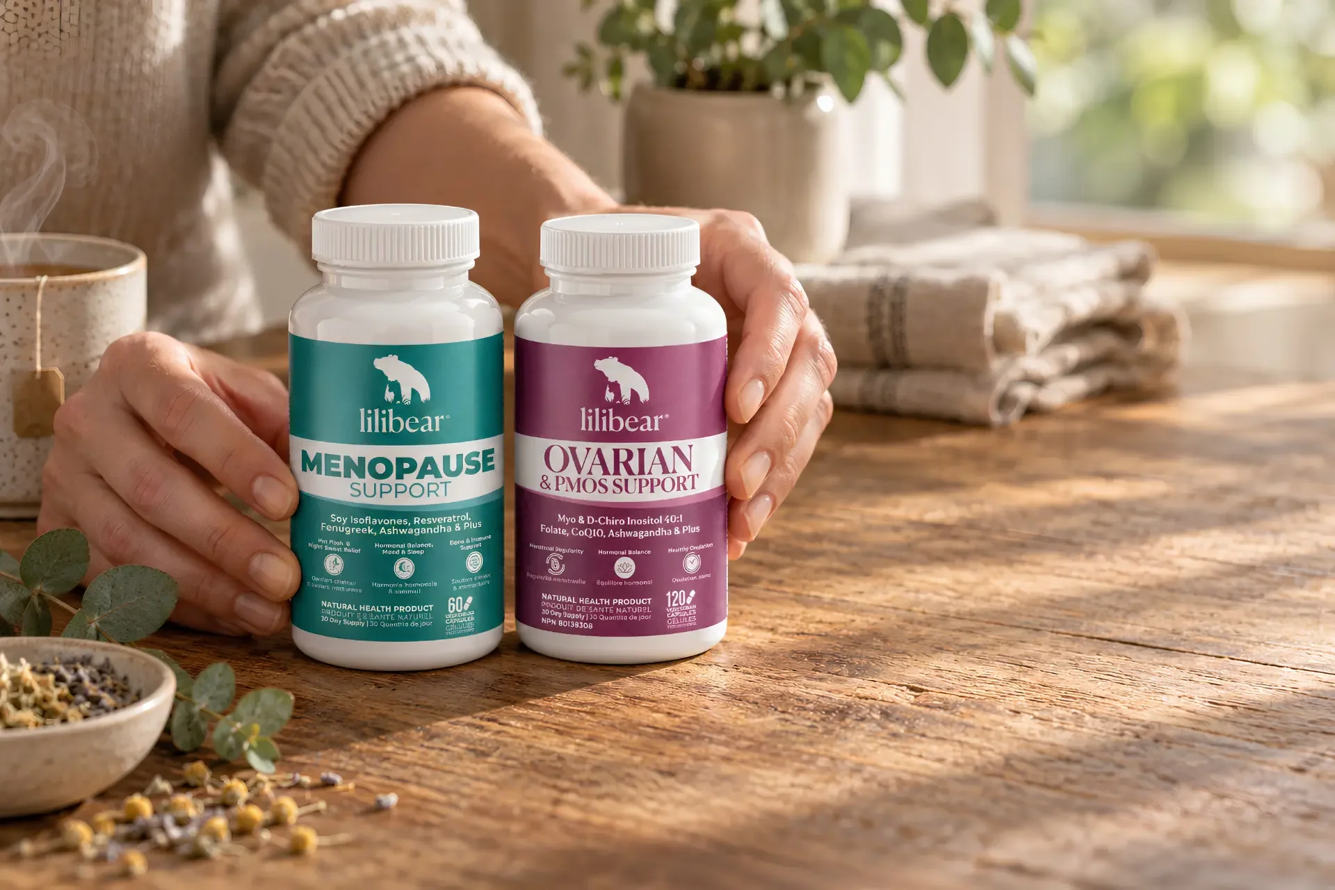 Lilibear Menopause Support and Ovarian & PCOS Support bottles on a warm tabletop beside a hand pouring capsules