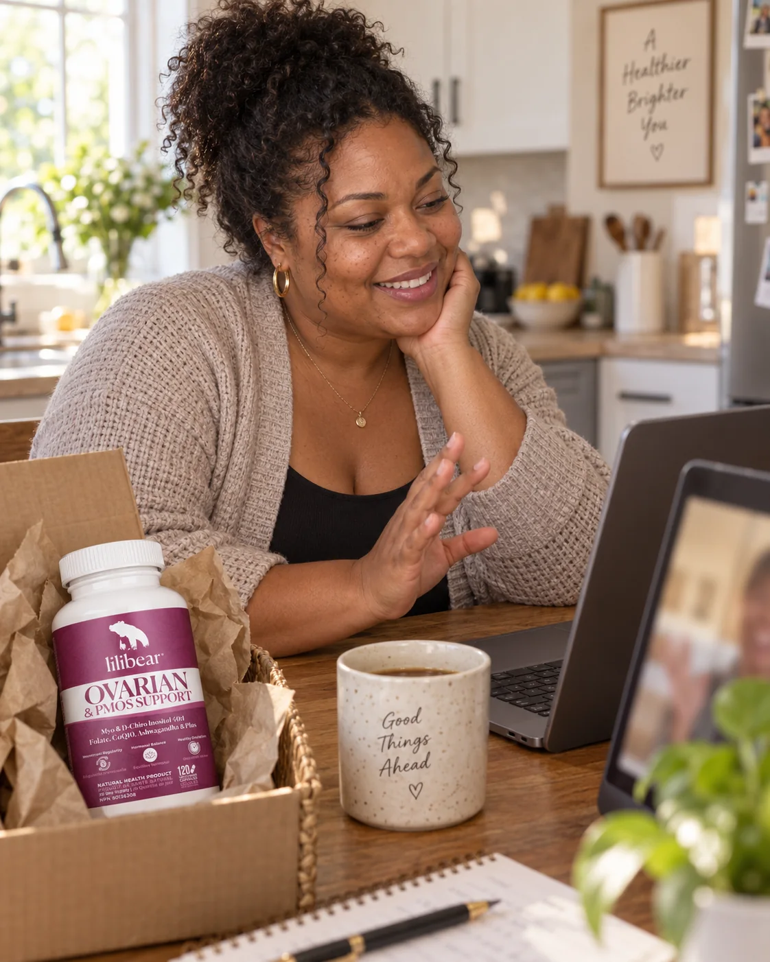 Woman on a video call unboxing Lilibear Ovarian & PMOS Support in her kitchen.